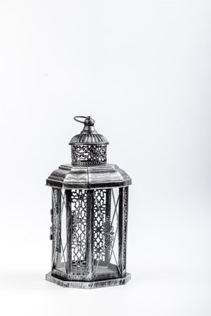 Beautiful vintage metal lantern on a white background close upの写真素材