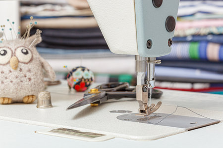 Sewing machine needle with thread and fabric close-upの写真素材