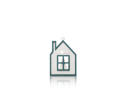 beautiful Christmas toy house on a white background close-upの写真素材
