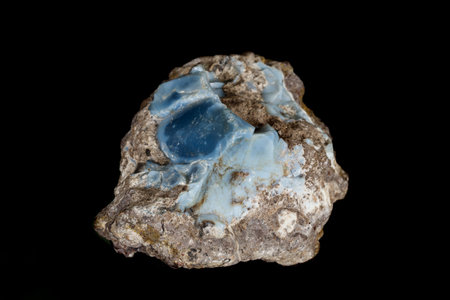 Macro stone Opal mineral in rock on a black background close upの写真素材