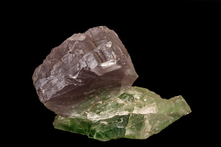macro mineral fluorite stone on black background close up