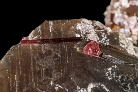 Tourmaline mineral stone close-up on a black background close up