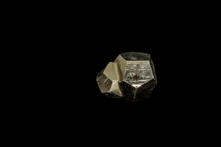 Macro mineral stone Pyrite on a black background close up