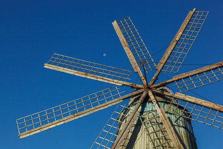windmill dutch type against blue sky close up