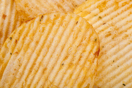 Lots of potato chips, texture close upの写真素材