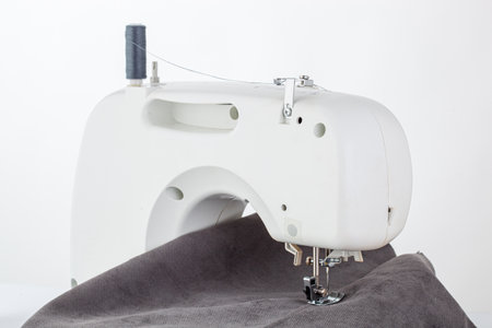 Sewing machine, stitching fabrics, needle in a round plan close upの写真素材