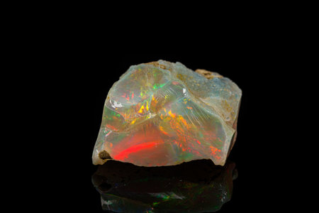 macro mineral stone rare and beautiful opals on a black background close-upの写真素材