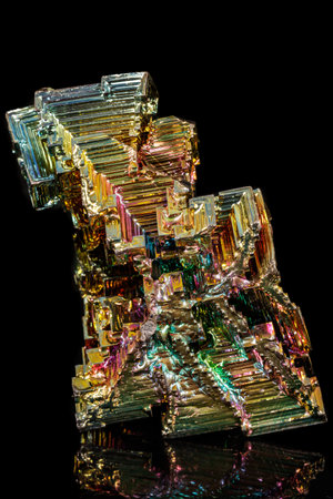 Macro of the stone bismuth mineral on a black background close upの写真素材
