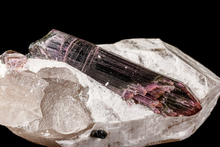 Macro stone tourmaline mineral on a black background close upの写真素材