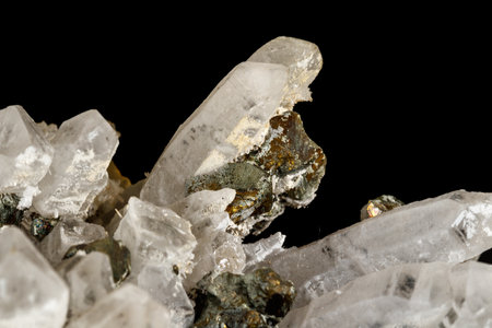 Macro stone Pyrite mineral in rock on a black background close up