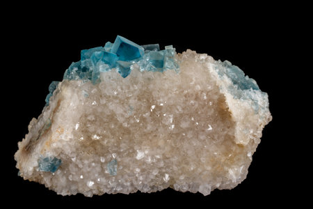 macro mineral fluorite stone on black background close up