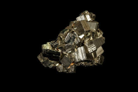 Macro mineral stone Pyrite on a black background close up