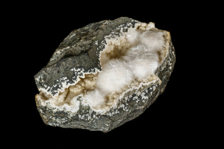 Macro stone Stilbite mineral on white black close up