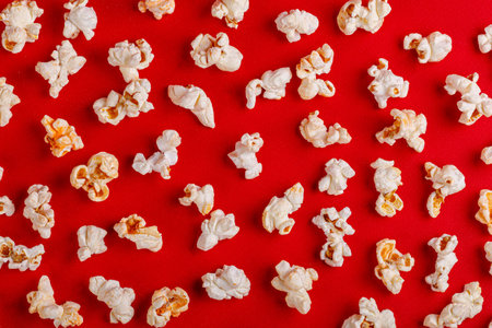 box with popcorn on a red background close-upの写真素材