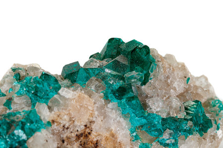 Macro mineral stone Dioptase silicate copper on a white background close up