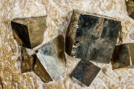 Macro stone Pyrite mineral in rock on a black background close up