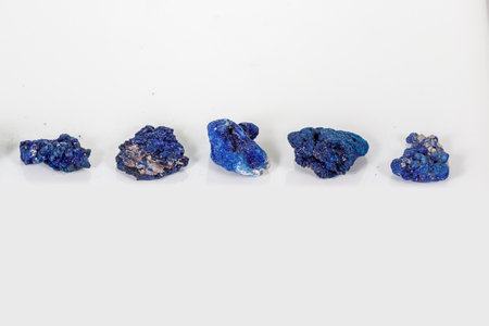 Macro mineral stone Malachite and Azurite against white background, close up