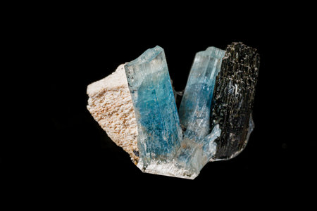 Macro stone mineral tourmaline aquamarine with a black background close upの写真素材