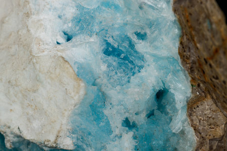 Macro stone cobalt calcite mineral on a black background close up