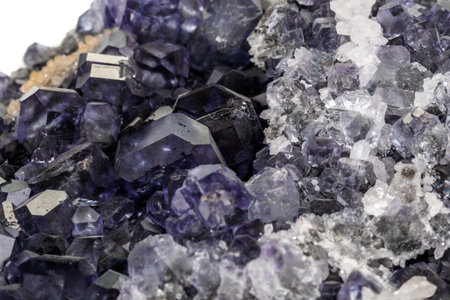 macro mineral fluorite stone on white background close up