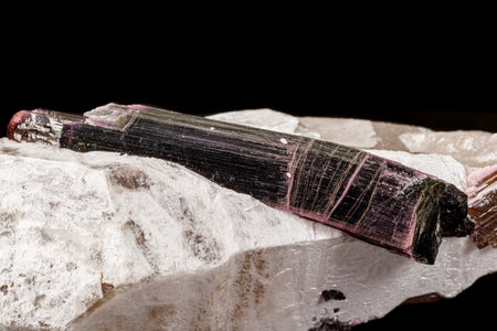 Macro stone tourmaline mineral on a black background close upの写真素材
