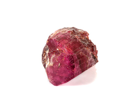 Macro red tourmaline mineral stone on white background close up