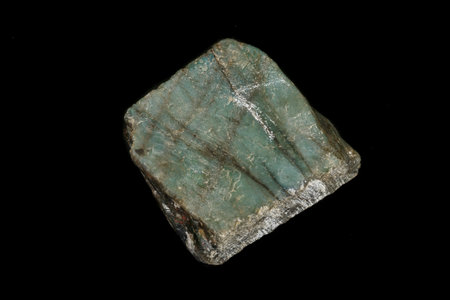 Macro of the stone Labradorite mineral on a black background close up