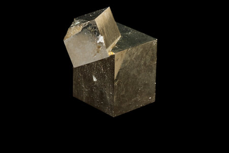 Macro mineral stone Pyrite on a black background close up