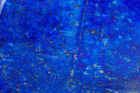 Macro of a mineral stone Lazurite on a white background close upの写真素材