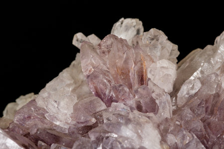 Macro of amethyst mineral stone on black background close up