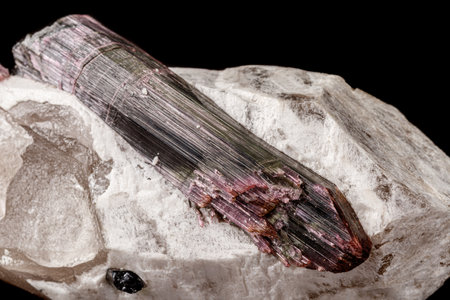 Macro stone tourmaline mineral on a black background close upの写真素材