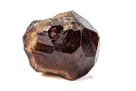 Macro stone Grossular mineral on white background close up