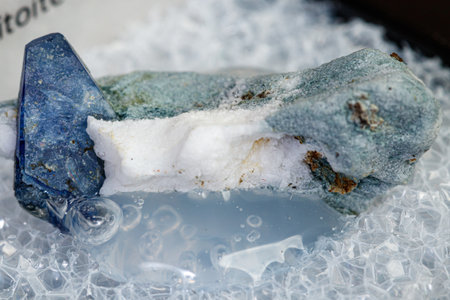 macro mineral stone Benitoite on a black background close-upの写真素材