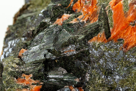 Macro stone mineral Diopside Calcite Magnetite on a white background close up
