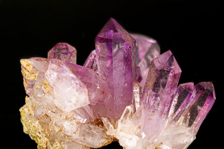 Macro of amethyst mineral stone on black background close upの写真素材