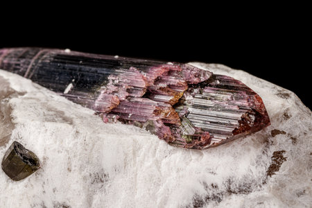 Macro stone tourmaline mineral on a black background close upの写真素材