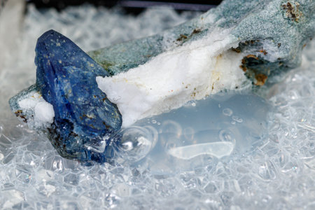 macro mineral stone Benitoite on a black background close-upの写真素材