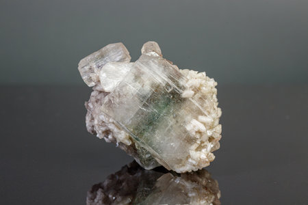 macro mineral stone Apophyllite stilbite on a gray background close upの写真素材