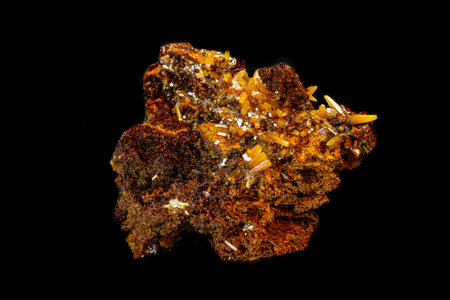 macro mineral Wulfenite stone on a black background close-upの写真素材