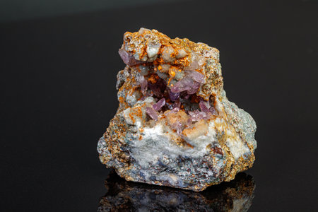 macro mineral amethyst stone in rock on a black background close-upの写真素材