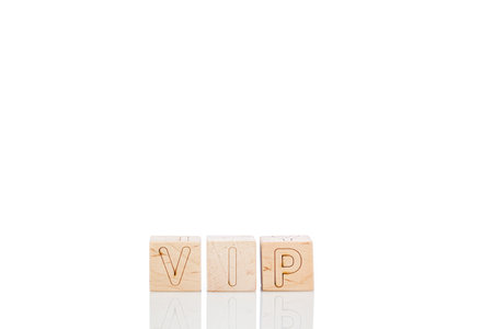 Wooden cubes with letters vip on a white background close-upの写真素材