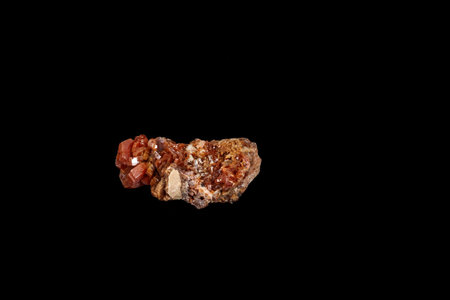 Macro mineral stone Vanadinite on a black background close up