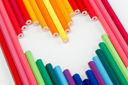 Multicolored pencils in the form of a heart close-upの写真素材
