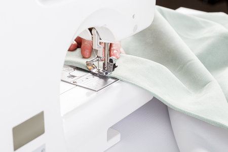 Sewing machine, stitching fabrics, needle in a round plan close upの写真素材