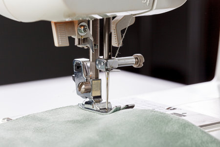 Sewing machine, stitching fabrics, needle in a round plan close upの写真素材