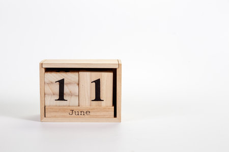 Wooden calendar June 11 on a white background close upの写真素材