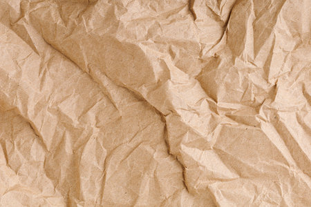 Brown texture kraft paper, recycled cardstock. Old crumpled recycled paper close-up of old crumpled recycled paperの写真素材