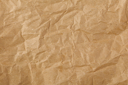 Brown texture kraft paper, recycled cardstock. Old crumpled recycled paper close-up of old crumpled recycled paperの写真素材