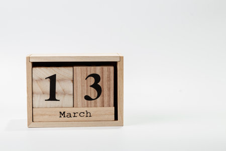 Wooden calendar March 13 on a white background close upの写真素材