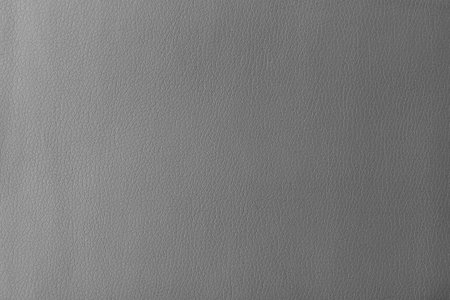 Texture of genuine leather, artificial leatherette gray background close-upの写真素材